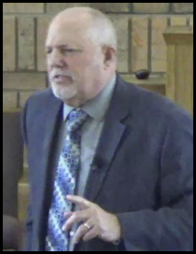 A person standing in front of a podium

AI-generated content may be incorrect.